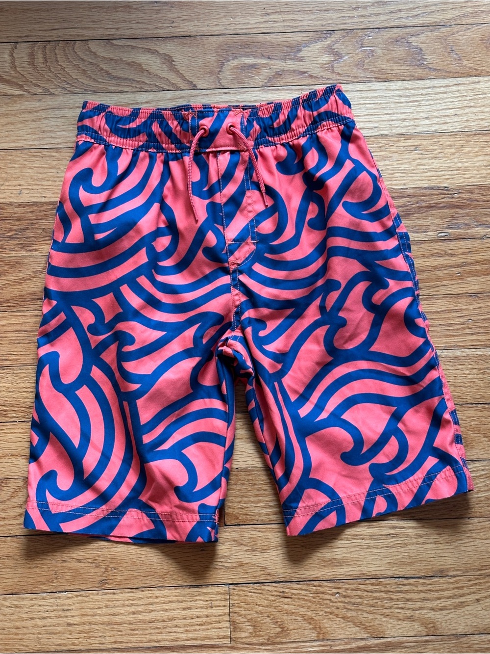Tea Collection Coral and Navy Swirl Swim Trunks